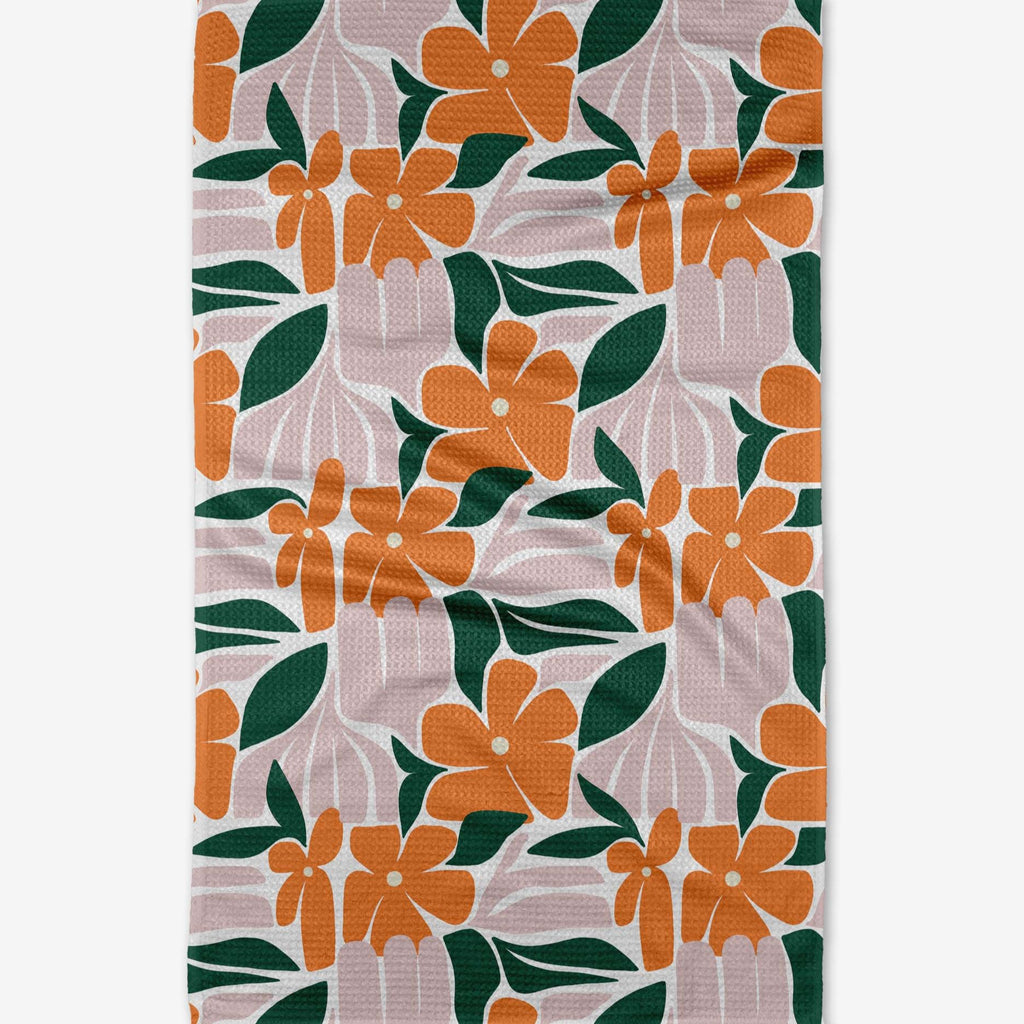 orange flowers with dark green leaves 