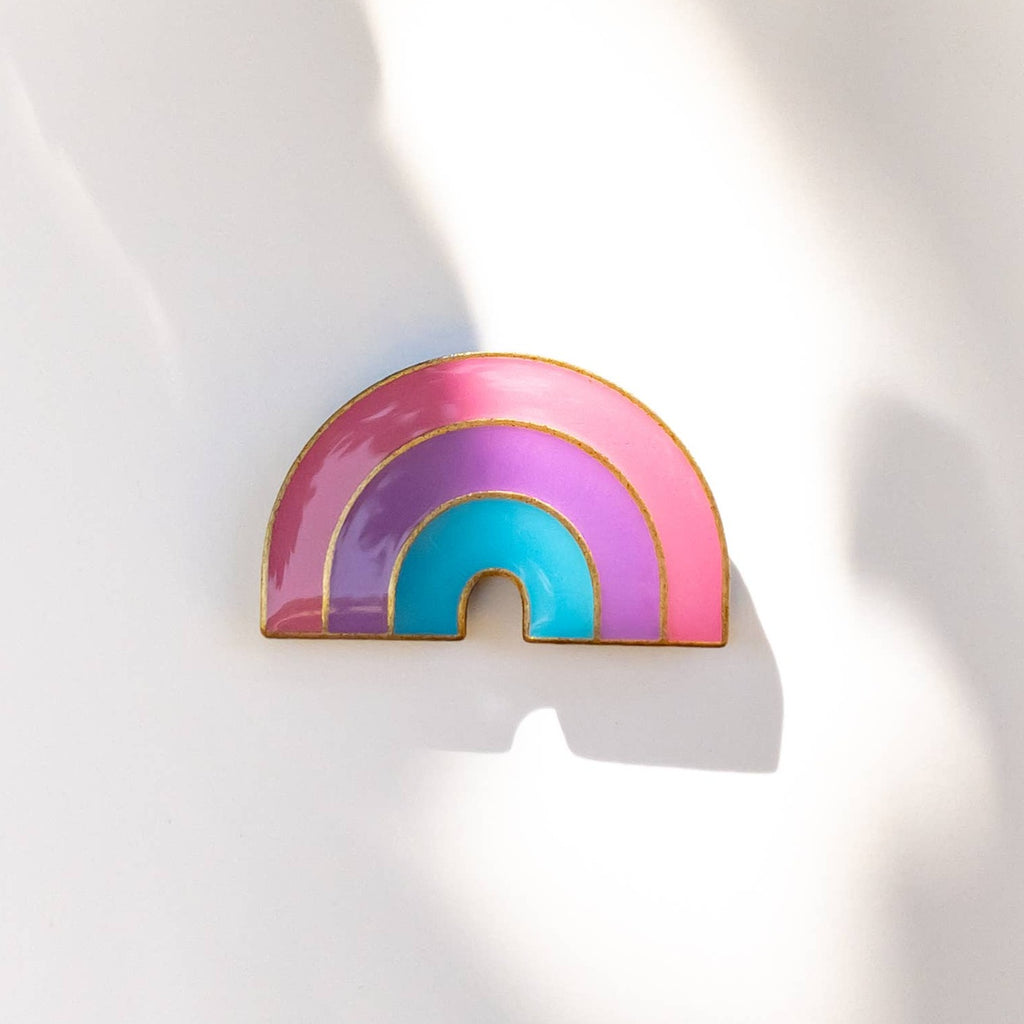 These LGBTQ+ Pride Rainbow pins have an antique brass and glossy epoxy finish for a classy vintage aesthetic. This pin features a retro style bisexual rainbow design. Enamel pins are perfect for wearing on jackets, backpacks, bags, and other accessories. They can also be used to decorate pin boards, cork boards, and other surfaces. Enamel pins are also a popular choice for collectors, as they can be used to create a unique and personal collection!  Size: 1.25" soft enamel pin