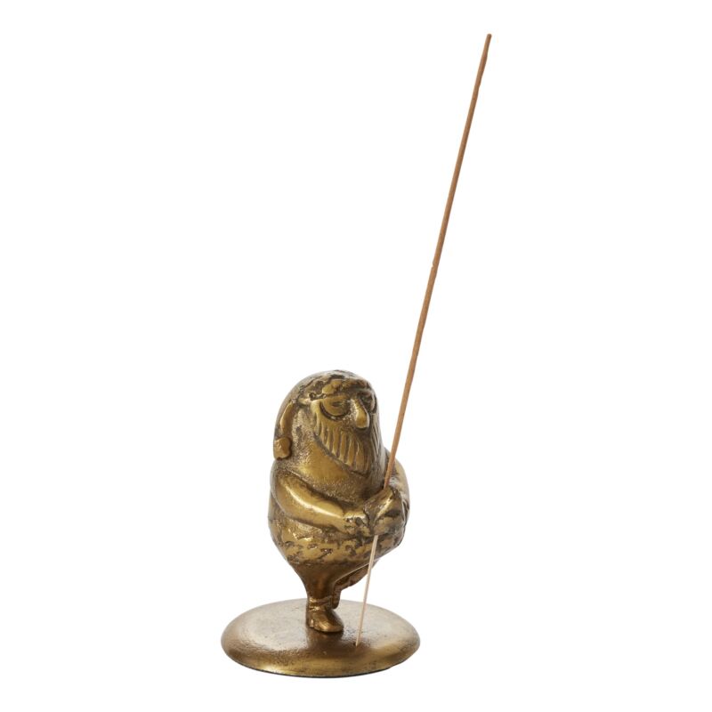 Set a merry, meditative mood with the Holiday Meditation Incense Holder, featuring Yogi Santa in tree pose to find a zen state. Made from classy antique gold, this playful piece makes a fun stocking stuffer or gift shop item (incense not included).