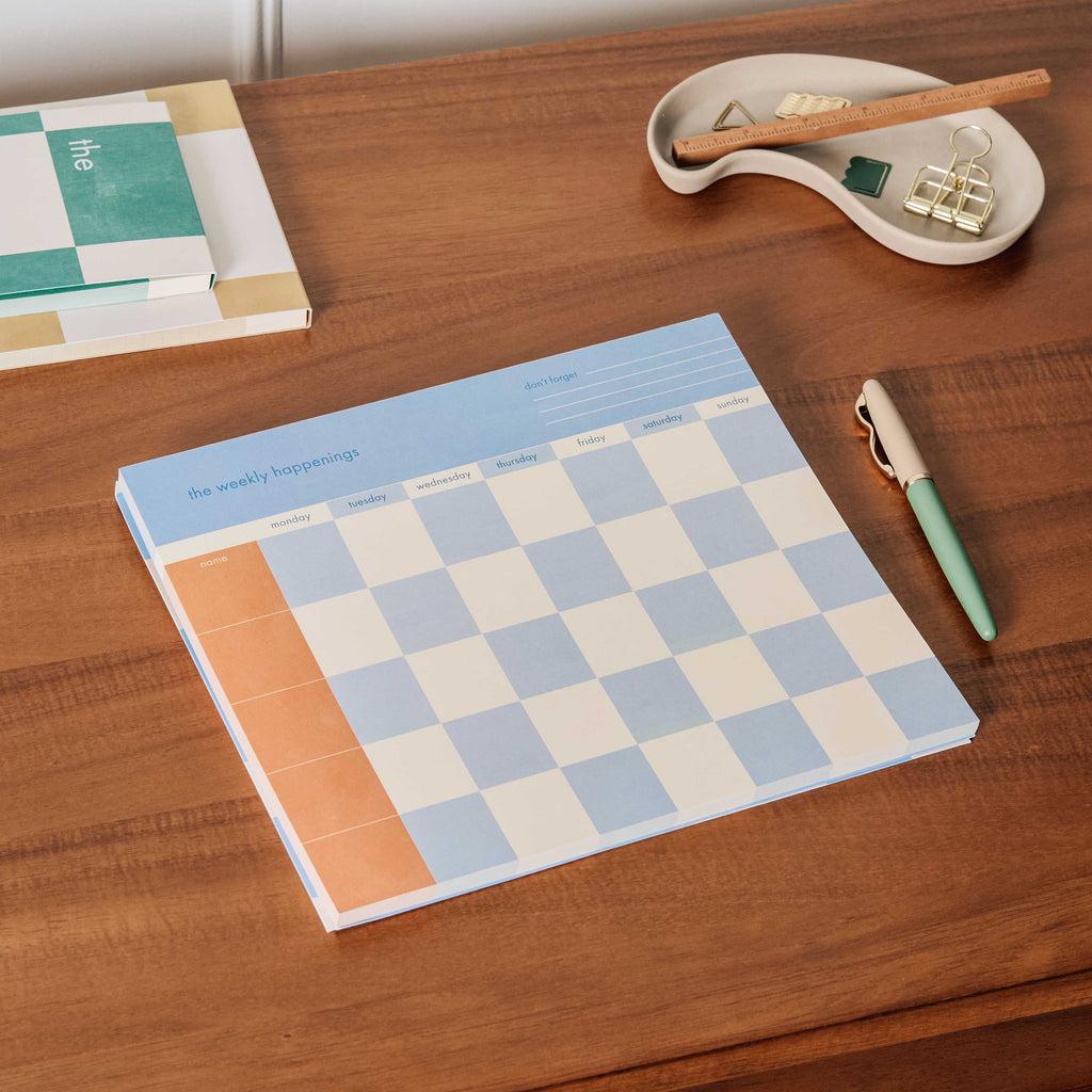 Declutter the family schedule with Papier’s Weekly Happenings listpad. Includes 60 tearaway pages with a simple grid format to keep you on top of everyone’s plans, to-dos and more. Comes in a clean, blue checkerboard design.