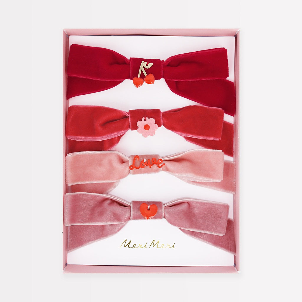 These charming large bows, made from soft, luxurious velvet in shades of red and pink, will instantly add a romantic touch to your look. The enamel embellishments provide a lovely detail as well. Ideal for a Valentine's party or any special celebration of love, such as a bridal shower or anniversary, they also make a sweet Valentine's gift for someone who adores accessories.