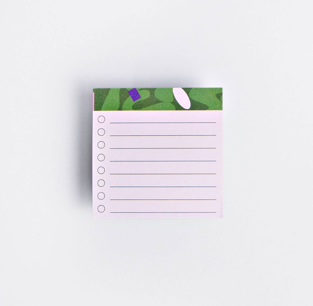 This is a pad of 50 sticky notes, measuring 7.1 x 7.1 cms. They're made in the UK using 80gsm FSC certified paper, featuring a bold green abstract design at the top of the pad.