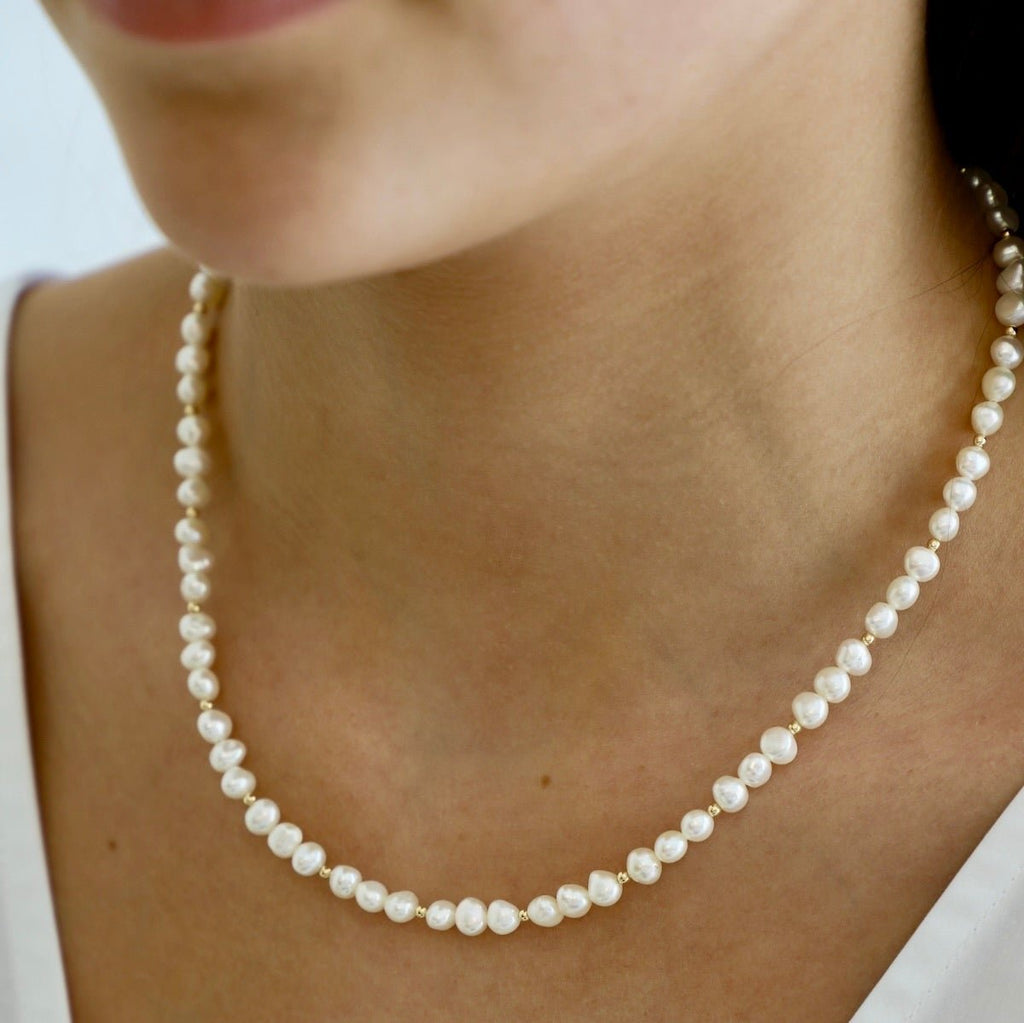 Our Kailani Necklace is a beautiful beachy necklace that is perfect to style everyday for this summer season. Made out of our freshwater nugget pearls and gold filled beaded accents, everyone will be asking you where you got your modern pearl necklace.