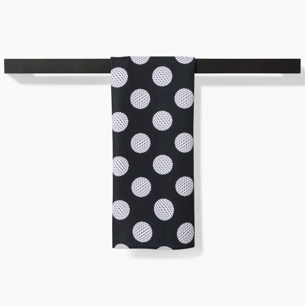 black tea towel with white golf ball polka dots