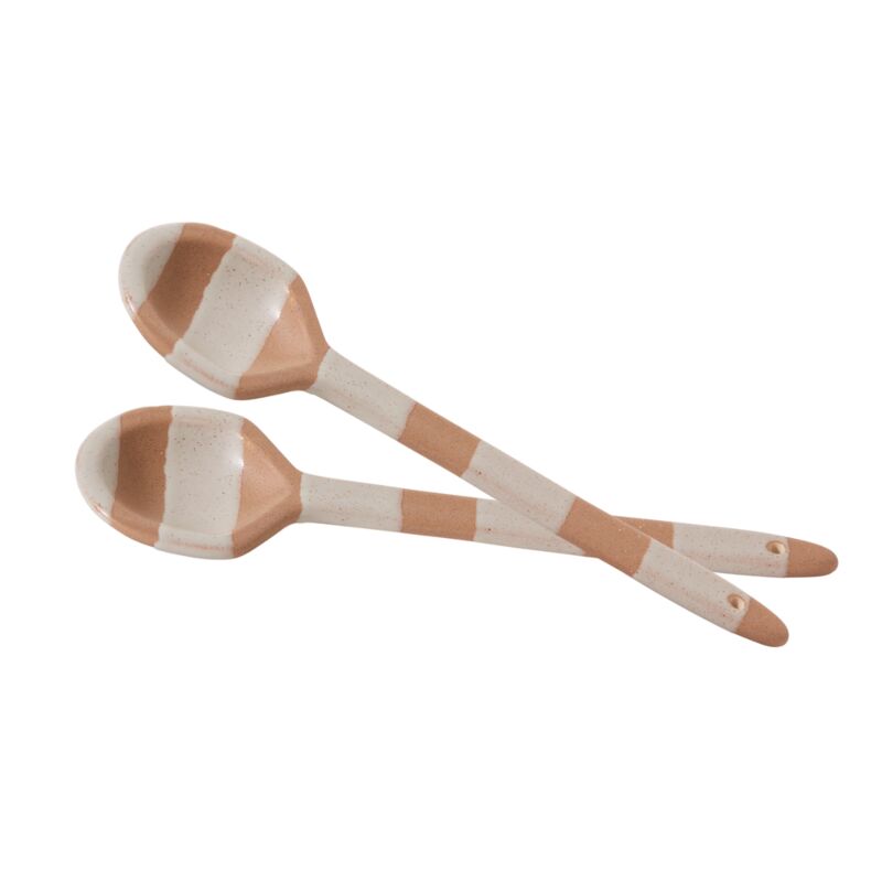 Elevate your kitchenware with the artful design of the set of 2 Botera Spoons. Featuring a food-safe finish on top of neutral, textured ceramic with contrasting chunky, speckled white glazed stripes, this set coordinates with the full Botera collection &amp; stands out with its minimalist sensibility. Holes at the end of handles allowing for hanging. We recommend hand washing to protect finish. 