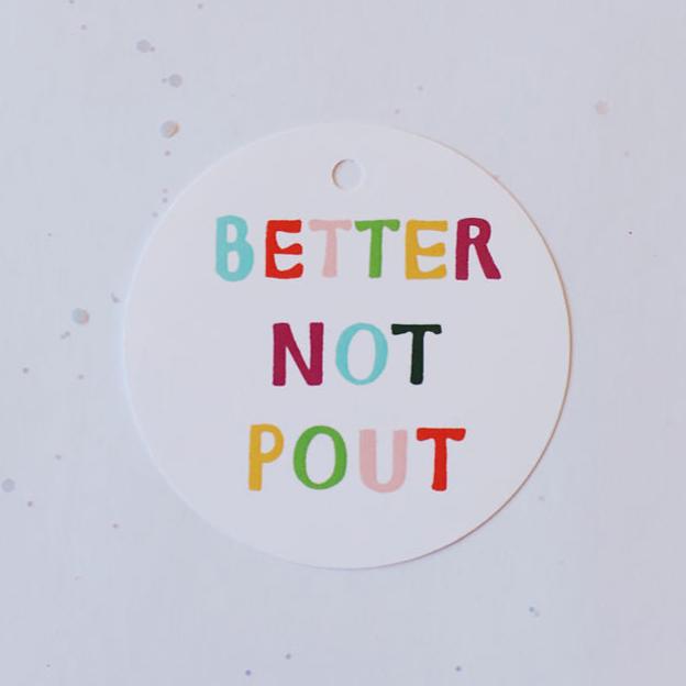 white circle gift tag reading "better not pout"