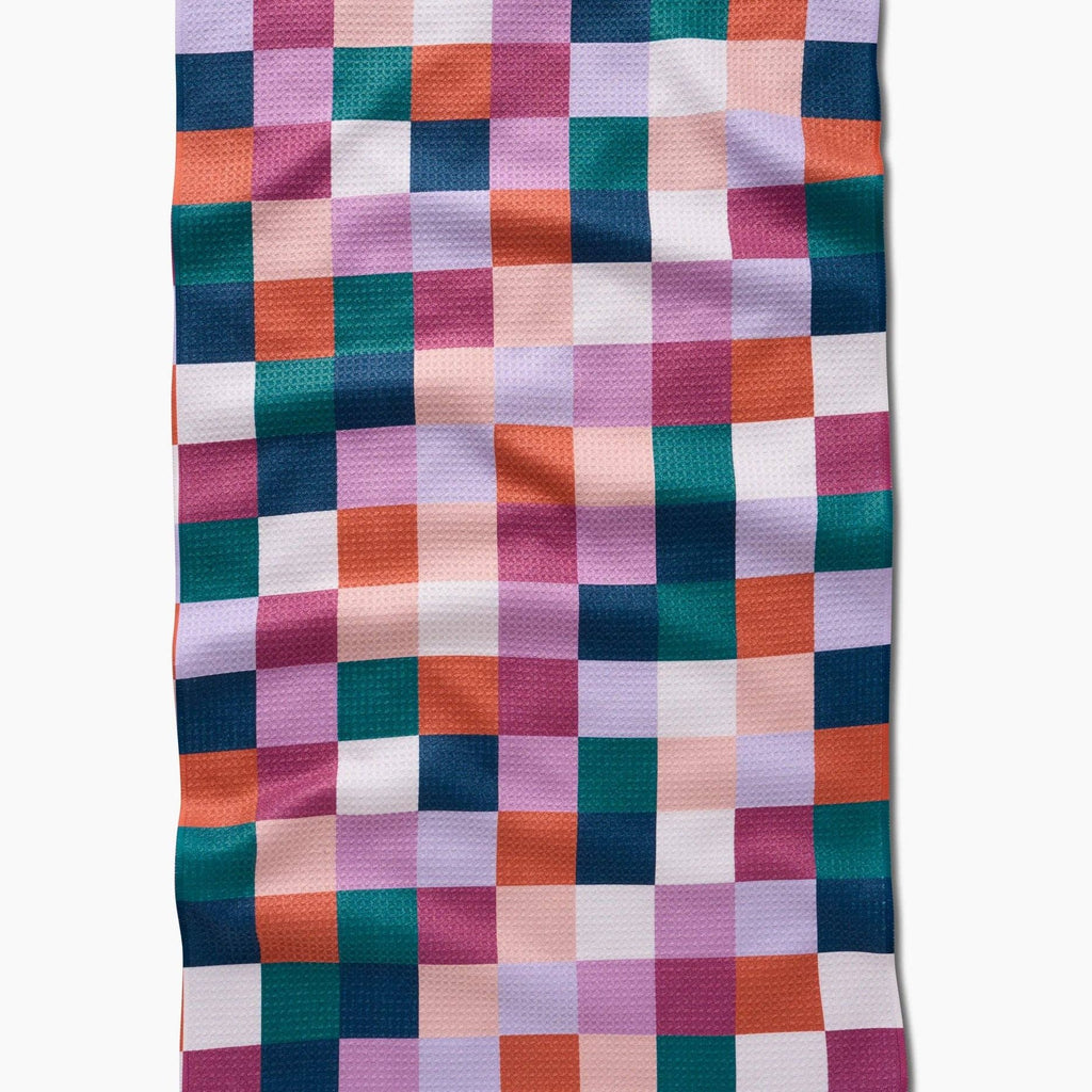 blues, pinks, and orange checkered tea towel