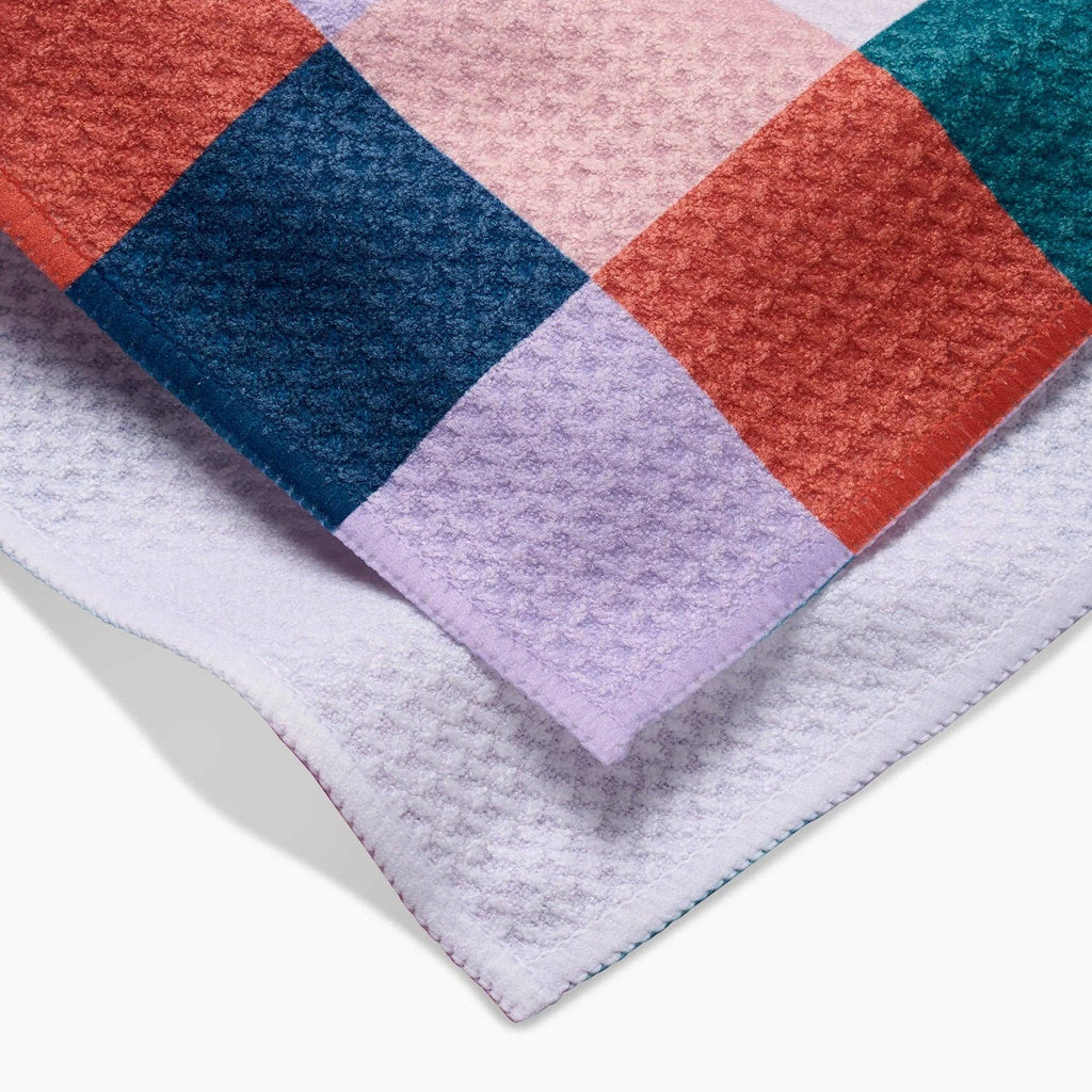 blues, pinks, and orange checkered tea towel