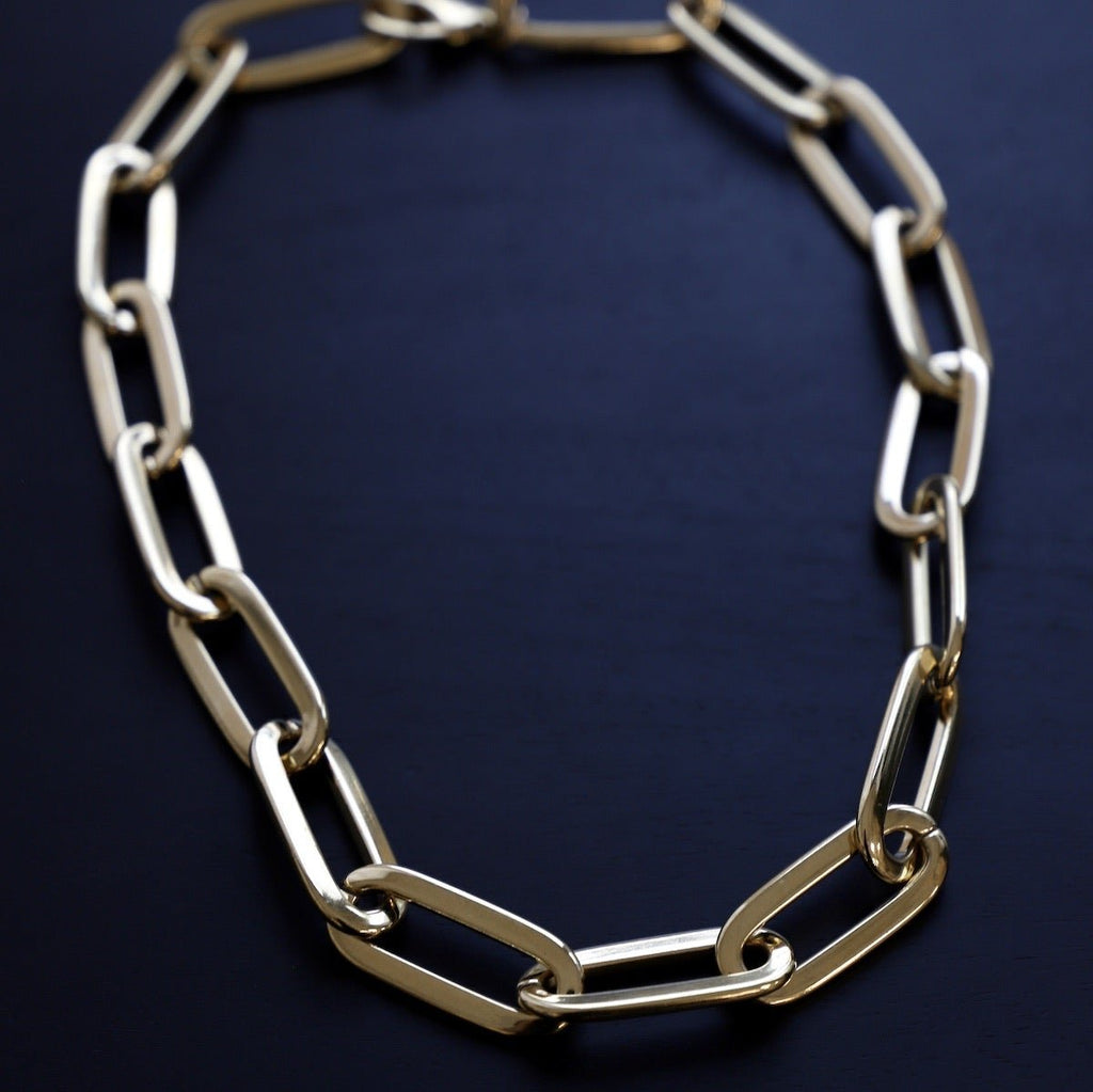 Make a bold statement with this All That Statement Chain Necklace. It features a large paperclip statement chain, perfect for a high fashion look. Made with our highest quality gold plating, this piece is made to last. Its unique appearance and eye-catching style will have everyone asking where you got your necklace. 24kt gold electroplated