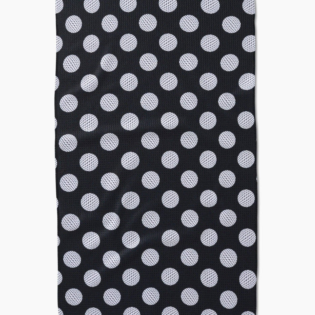 black tea towel with white golf ball polka dots