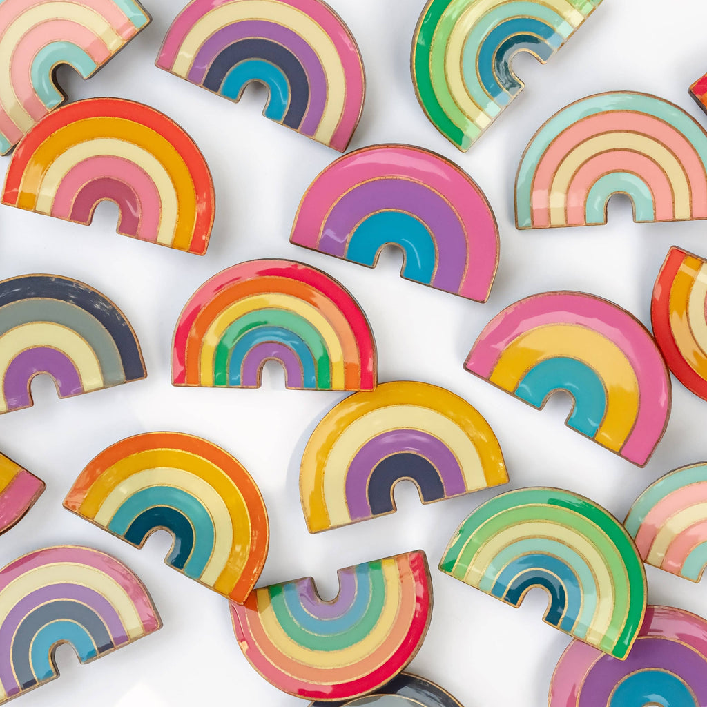 These LGBTQ+ Pride Rainbow pins have an antique brass and glossy epoxy finish for a classy vintage aesthetic. This pin features a retro style non-binary rainbow. Enamel pins are perfect for wearing on jackets, backpacks, bags, and other accessories. They can also be used to decorate pin boards, cork boards, and other surfaces. Enamel pins are also a popular choice for collectors, as they can be used to create a unique and personal collection!  Size: 1.25" soft enamel pin