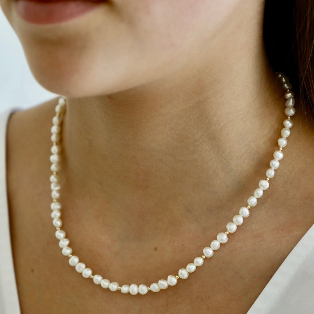 Our Kailani Necklace is a beautiful beachy necklace that is perfect to style everyday for this summer season. Made out of our freshwater nugget pearls and gold filled beaded accents, everyone will be asking you where you got your modern pearl necklace.