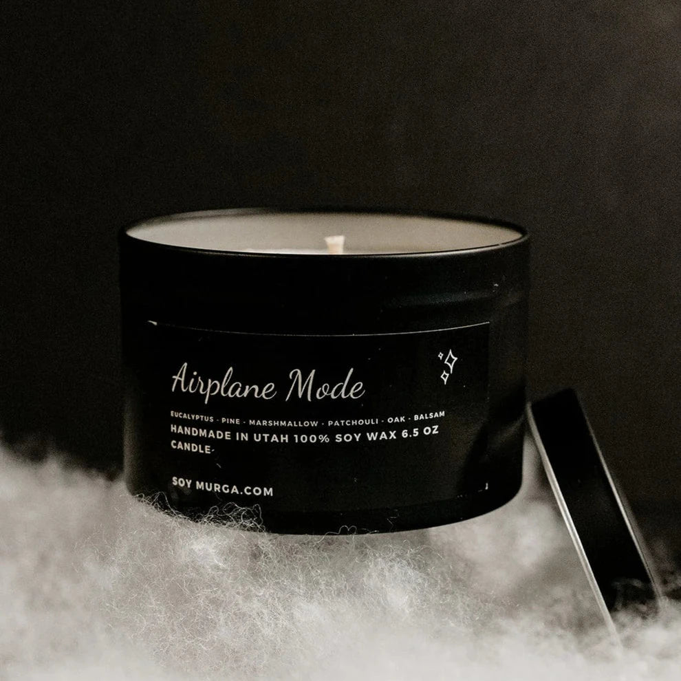 6.5 oz airplaine mode soy candle hand poured in a matte black tin