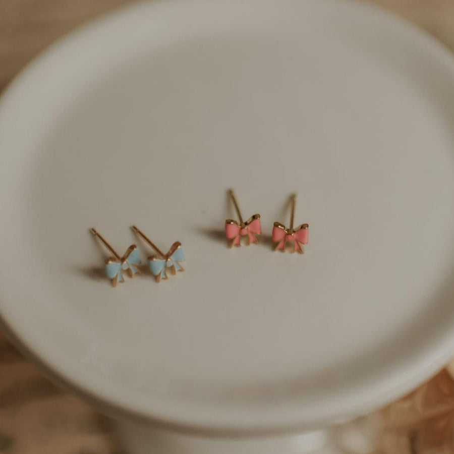 gold vermeil bow studs in baby blue and pink rose