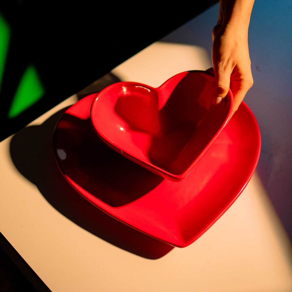 Indulge in the luxurious simplicity of our Red Heart Bowl. Handcrafted with care, its unique design features a striking red heart, adding a pop of color to any space. Perfect for displaying your favorite items or as a standalone piece of art. Elevate your decor with this exclusive bowl.