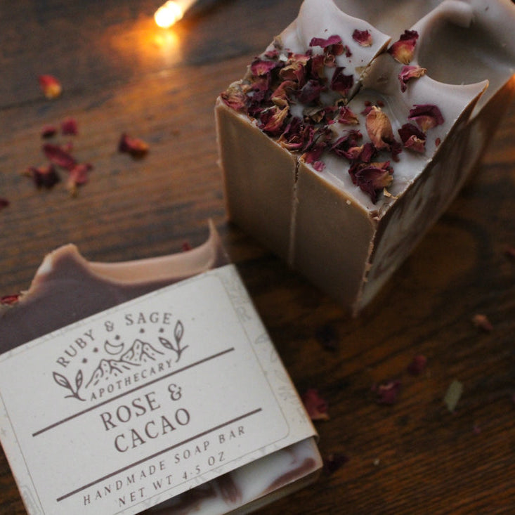 brown and white swirled soap with dried rose petals