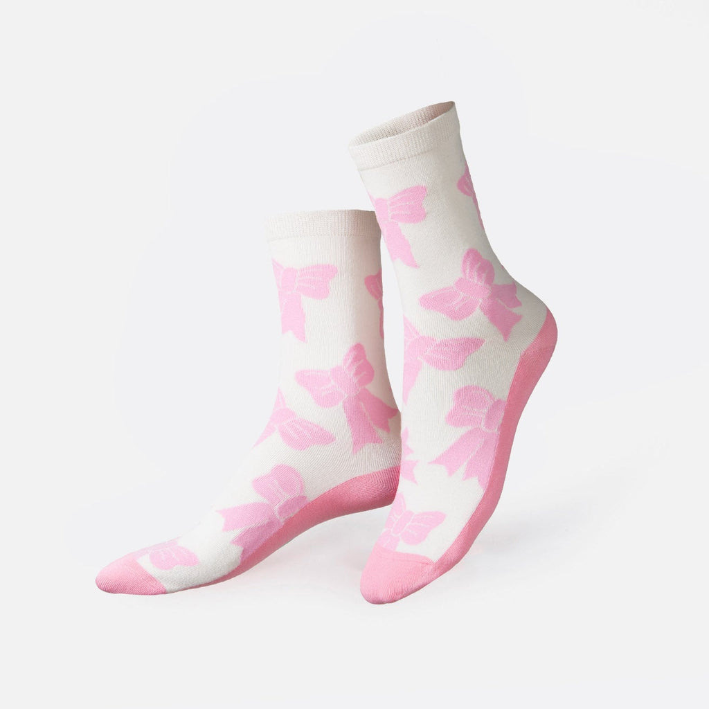 Dive into the ethereal ballet world and the whimsical allure of coquetry with our enchanting bow-shaped socks.