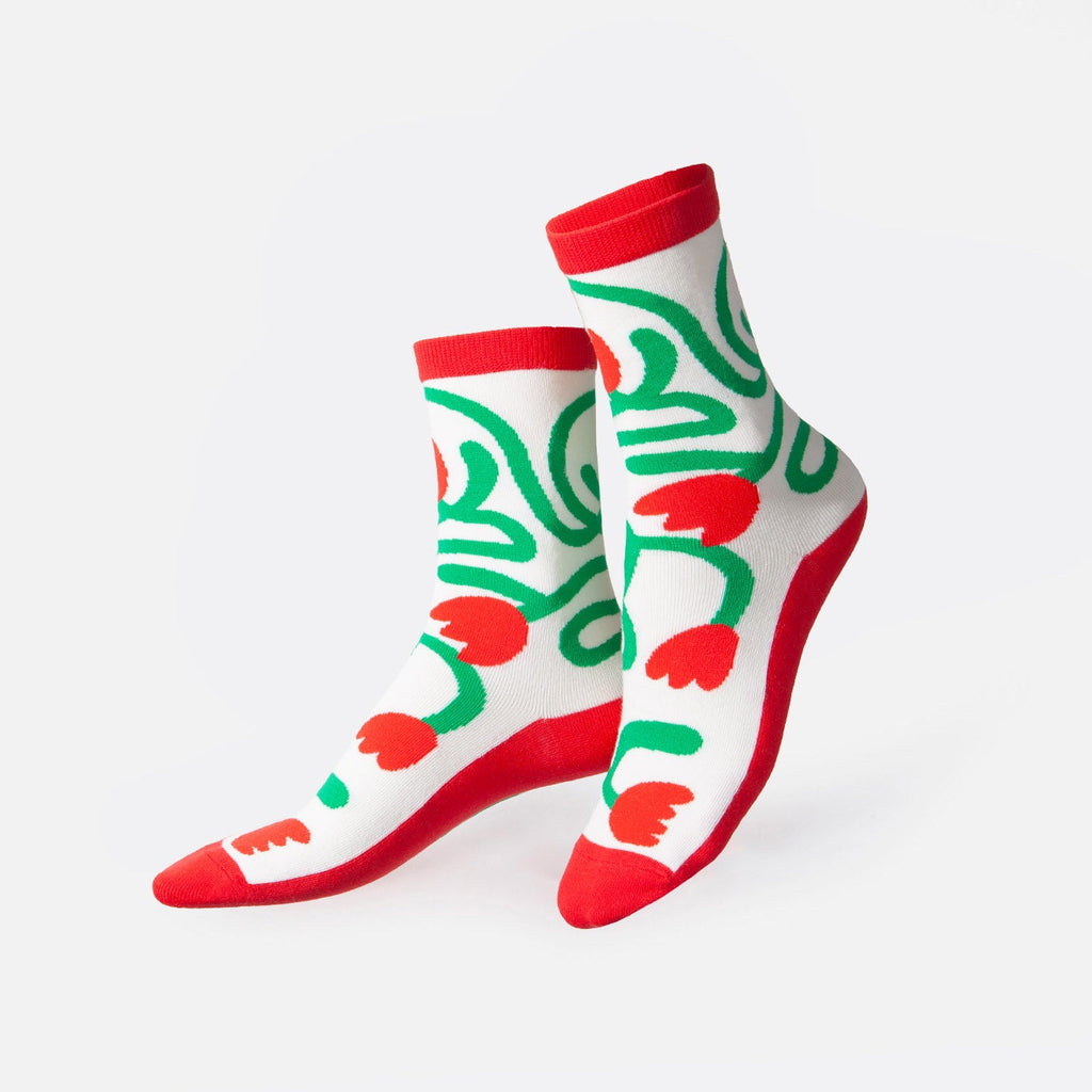 Step into floral fun with these tulip-shaped socks. Designed to add a touch of springtime charm to any outfit, these socks are as fresh as they are fashionable.