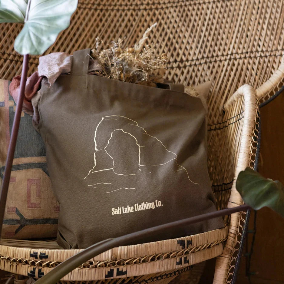 Brown heavy weight canvas tote featuring delicate arch