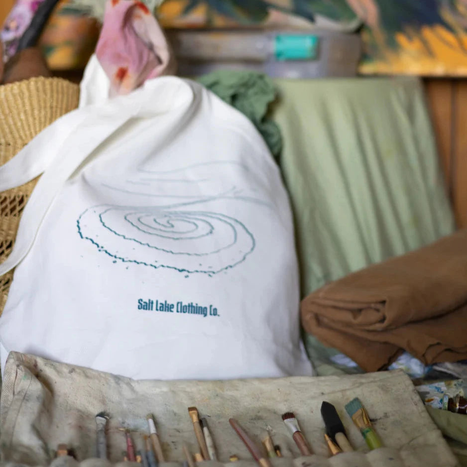 white field carry bag featuring a sketch of everybody's' favorite art-stones.