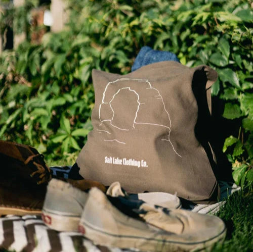 Brown heavy weight canvas tote featuring delicate arch