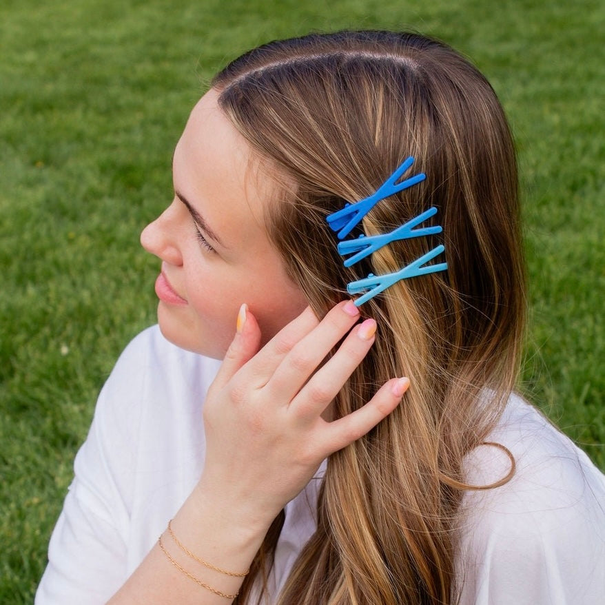 This 3 pack of bobby pins are the cutest hair accessories for any wardrobe! Coming in 3 different shades of light blue and measuring at 2.25 inches long, they add the final touch of color to any outfit. Andi’s bobby pins are made so you don't have to worry about your hair falling, or readjusting; they're so comfy, you might forget you have them in!