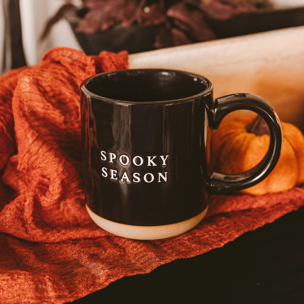 Get in the spirit of "spooky season" with this black stoneware coffee mug featuring cozy white lettering. Perfect for sipping your favorite brew while enjoying all the frightful fun!