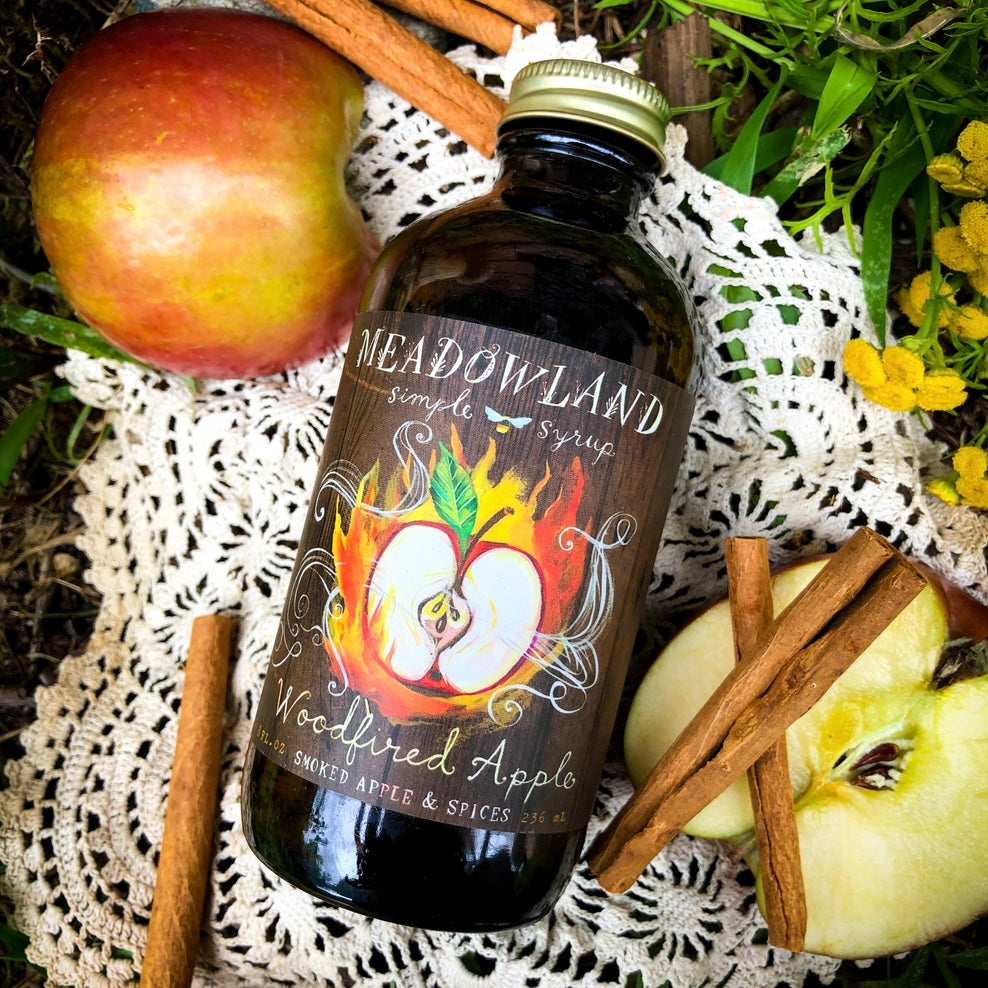 This Oregon-made, handcrafted simple syrup is a delightful addition to all your wintertime favorites; a hot cup of tea or a toddy at bedtime, or try it in apple cider for a smoky, cozy flavor. Tasting Notes: crisp autumn apples, a crackling fire, soft cinnamon, spicy clove, a twilit sky. Ingredients: golden brown sugar, apple juice, smoked apples, cinnamon, clove, orange zest, cream of tartar