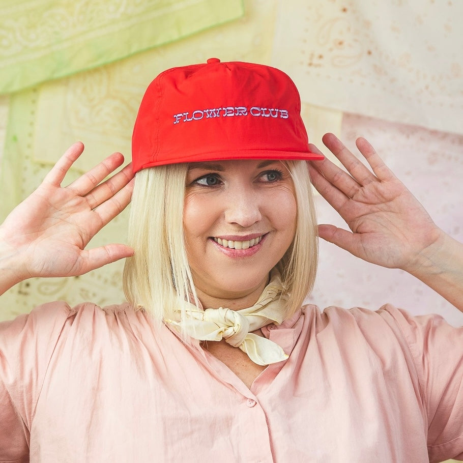 The Flower Club hat is embroidered locally in Utah and is the perfect accessory! It such a fun way to add color to any outifit! Each hat can be adjusted on the back to fit just right. This is an original Lars design.