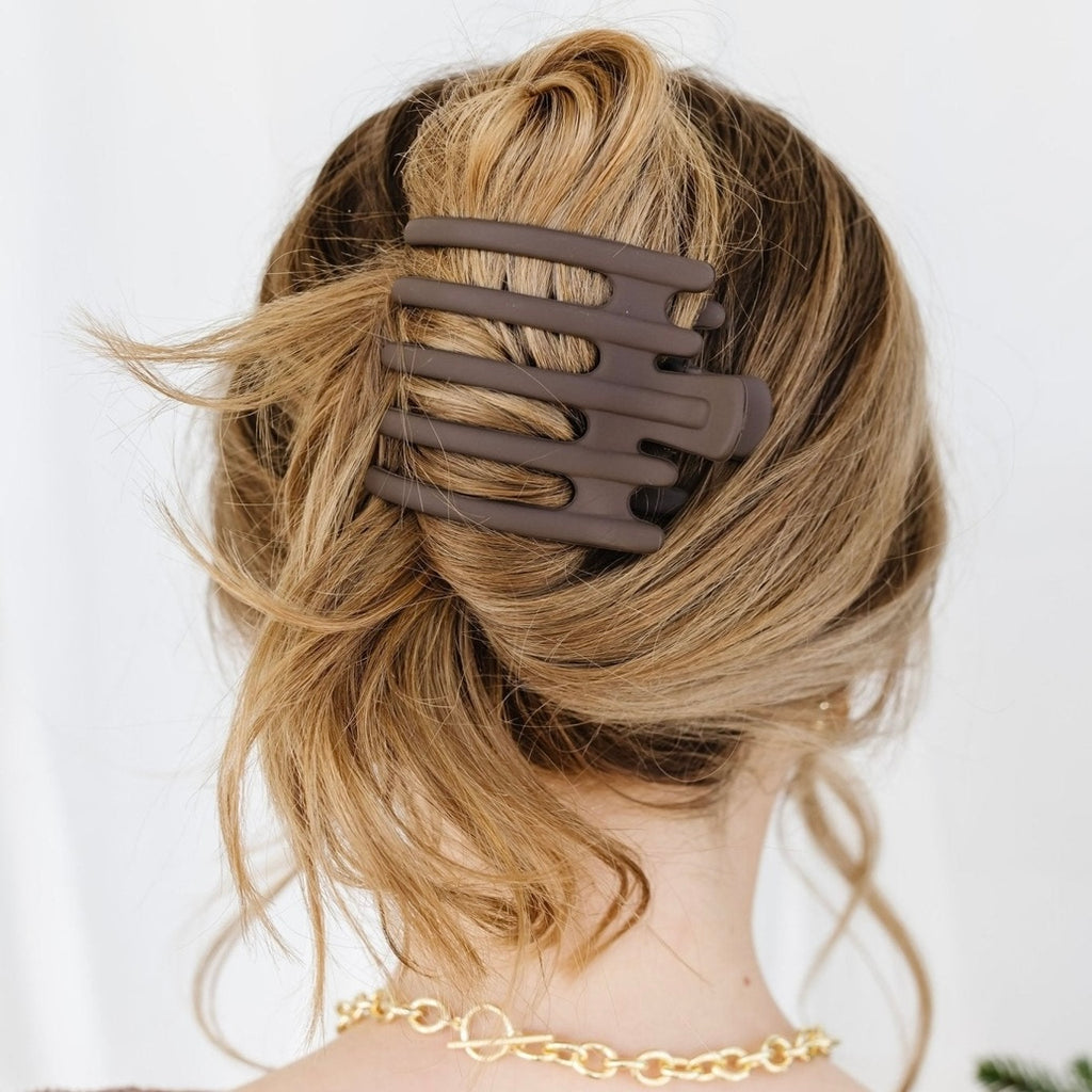 You are going to LOVE this new claw clip that will elevate your hair game! These clips are a pretty 5 prong claw that come in a dark brown color. They have a unique design that will make it easier to hold more hair, i'm talking to you thick hair ladies! You can wear it in a half up or a French twist style. They are 3.5 inches long and going to be your new favorite clip!