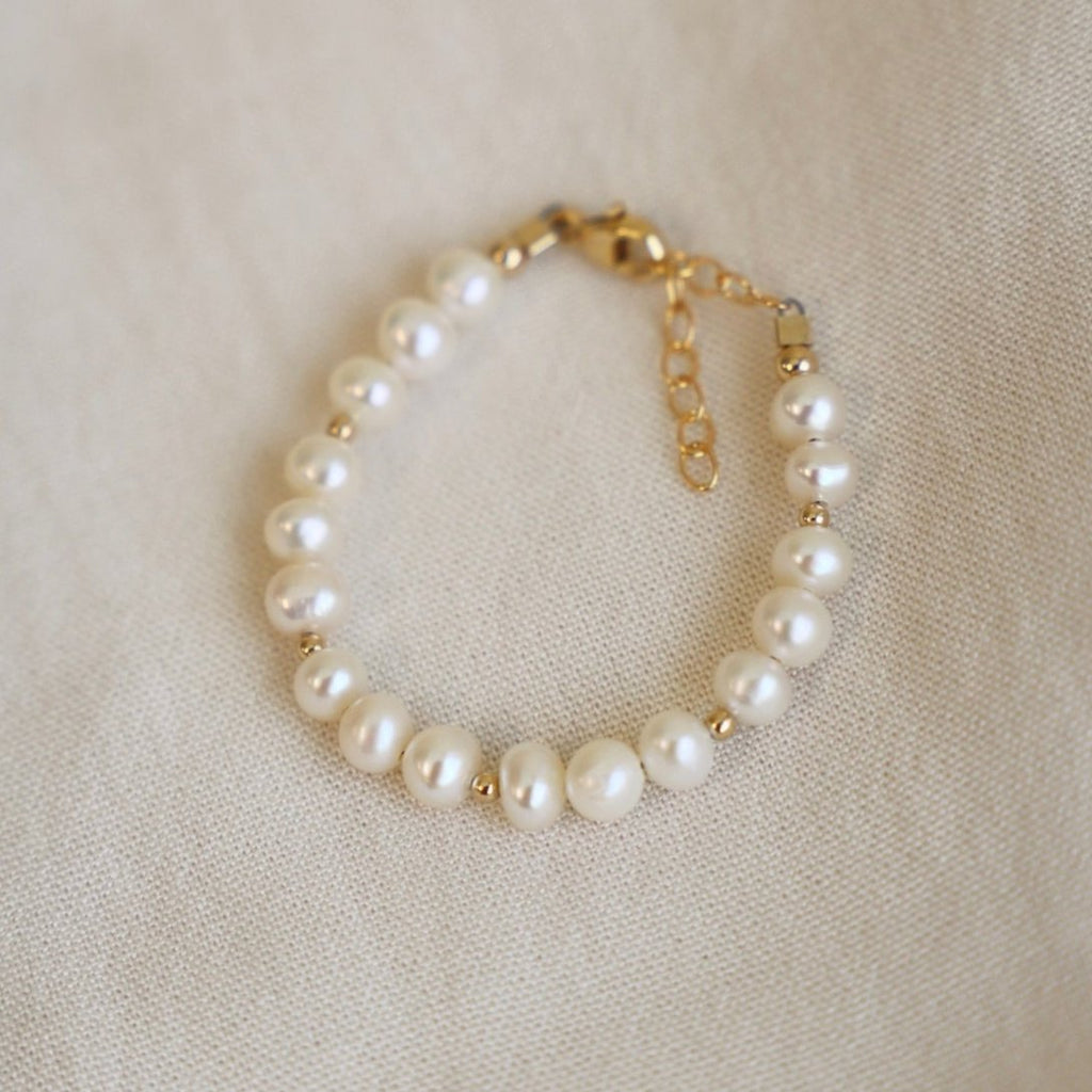 Our Kailani Bracelet s a beautiful beachy bracelet that is perfect to style everyday for this summer season. Made out of our freshwater nugget pearls and gold beaded accents, everyone will be asking you where you got your modern pearl bracelet. This is the kids version of our adult style Kailani bracelet.