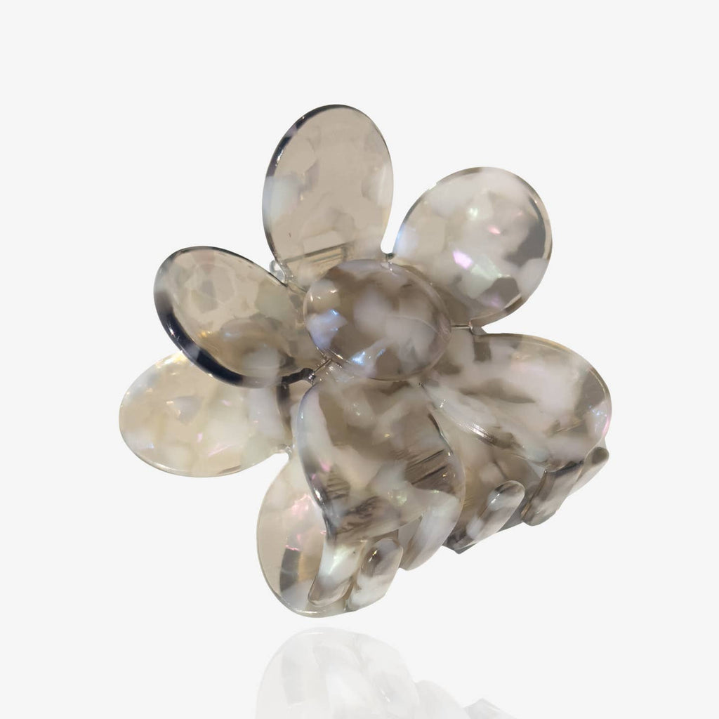 Get your hair ready for any occasion with our Flower Hair Claw in a unique translucent grey color with speckled details. The large flower design adds a playful touch to your hairstyle.