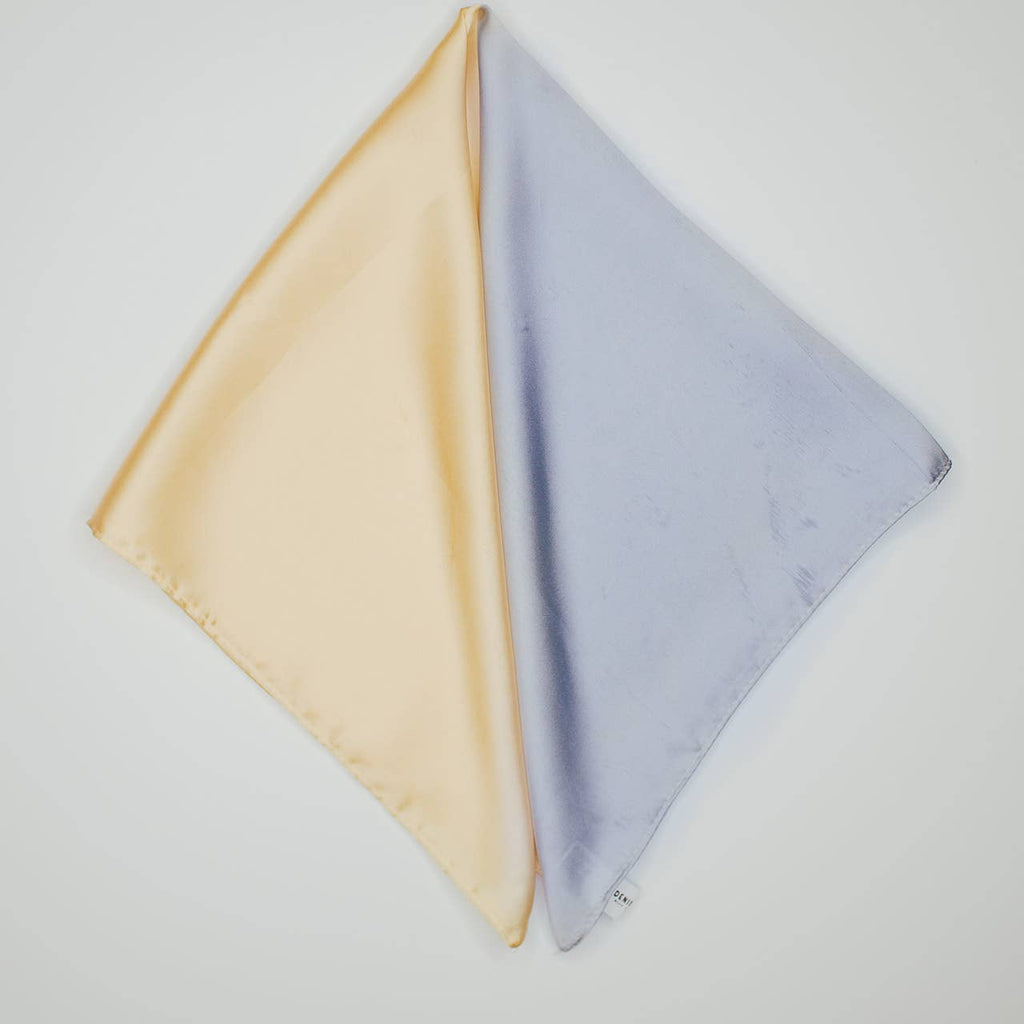 Revamp your hair game with our Silk Bandana in a soft yellow and dusty blue! This versatile hair scarf adds a touch of style and fun to any look. Whether you tie it around your ponytail or wear it as a headband, our two toned bandana is the perfect accessory for any occasion.