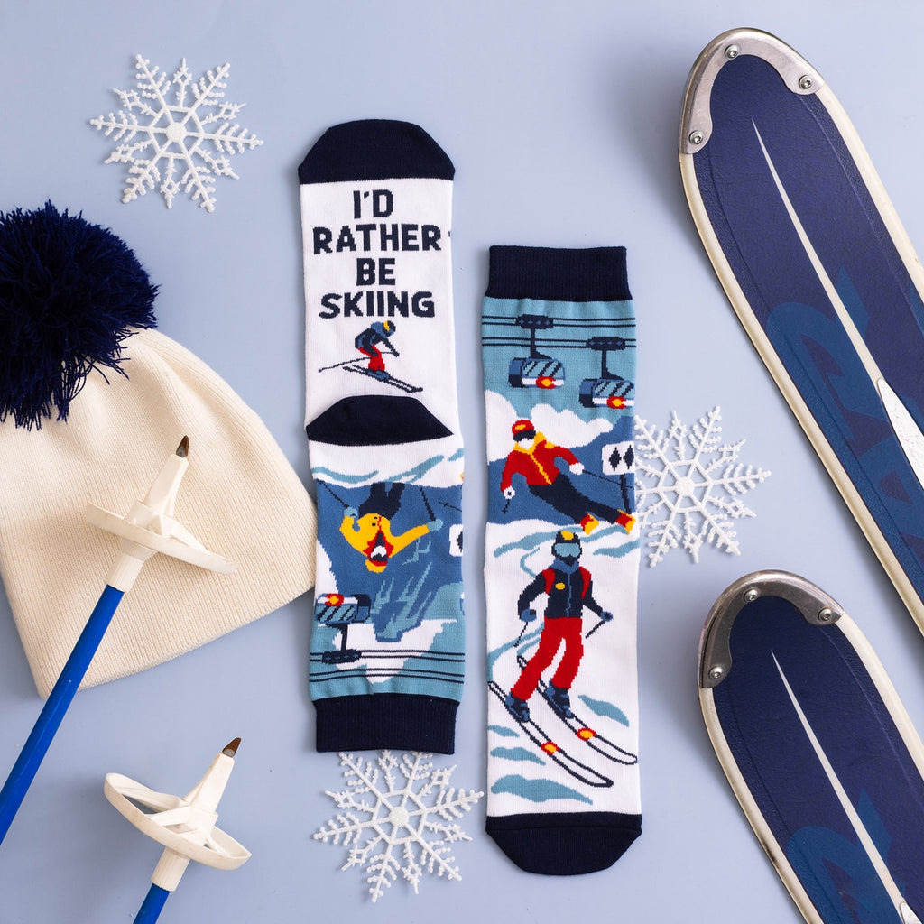 Gear up for the ski season with our I’d Rather be Skiing socks! These socks are more than just an accessory; they're a statement for winter sports fans who live for the slopes. Whether you're carving down the mountain, lounging in the chalet, or relaxing at home, these socks will look and feel amazing. Made from a premium performance blend, these socks are super soft, breathable, and designed to keep feet warm and cozy.