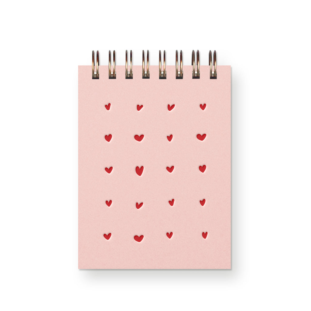 The perfect mini journal to jot down notes and ideas! Letterpress printed hearts are designed on the cover and blank inside pages to allow room for notes, lists, doodles, and more!