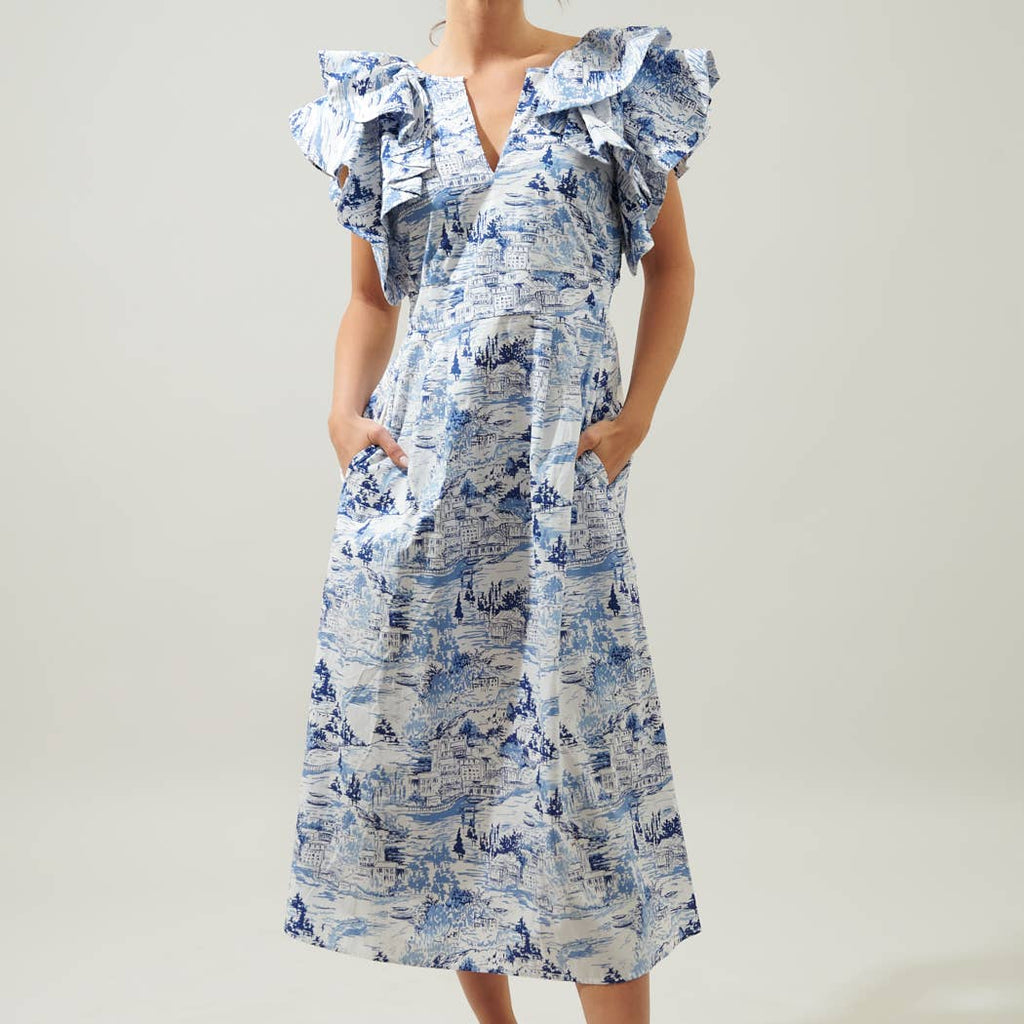 Paint the sky in this tonal blue pastoral printed midi. A refreshing take on the perfect vacay dress, it's embodied by a lightweight and airy cotton. Voluminous ruffle layered cap sleeves frame a split neckline. It maintains a relaxed fit with an A line midi skirt and pockets for convenience. Wear it with a floppy hat, woven accessories and mules.