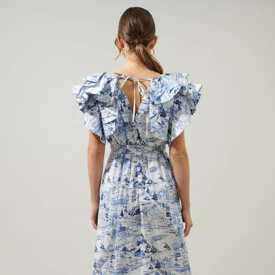 Paint the sky in this tonal blue pastoral printed midi. A refreshing take on the perfect vacay dress, it's embodied by a lightweight and airy cotton. Voluminous ruffle layered cap sleeves frame a split neckline. It maintains a relaxed fit with an A line midi skirt and pockets for convenience. Wear it with a floppy hat, woven accessories and mules.