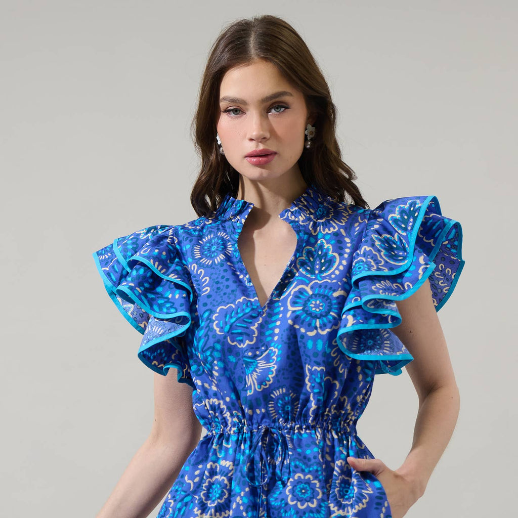 Make your style bloom in the Kenner Floral Alina Ruffle Shift Mini Dress. Dramatic ruffles around the short sleeves frame split neckline with a mock ruffle neck. The bodice has a shift design and a drawstring belt around the waist. Don’t forget to add gold accessories to match the dress.