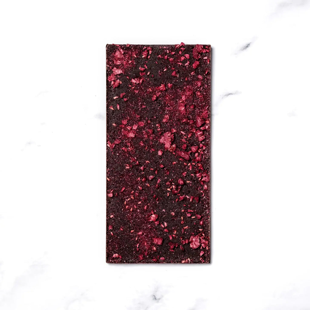 This bar is the perfect celebratory treat—the tasting notes of sparkling white wine infused cacao complement the sweet tartness of the raspberries. Whether you’re celebrating the end of a day on the ski hill, toasting a birthday, or cheering at midnight on New Year’s Eve, this bar is sure to bring you cheer & chocolate. This bar is best paired with a long day in the mountains.