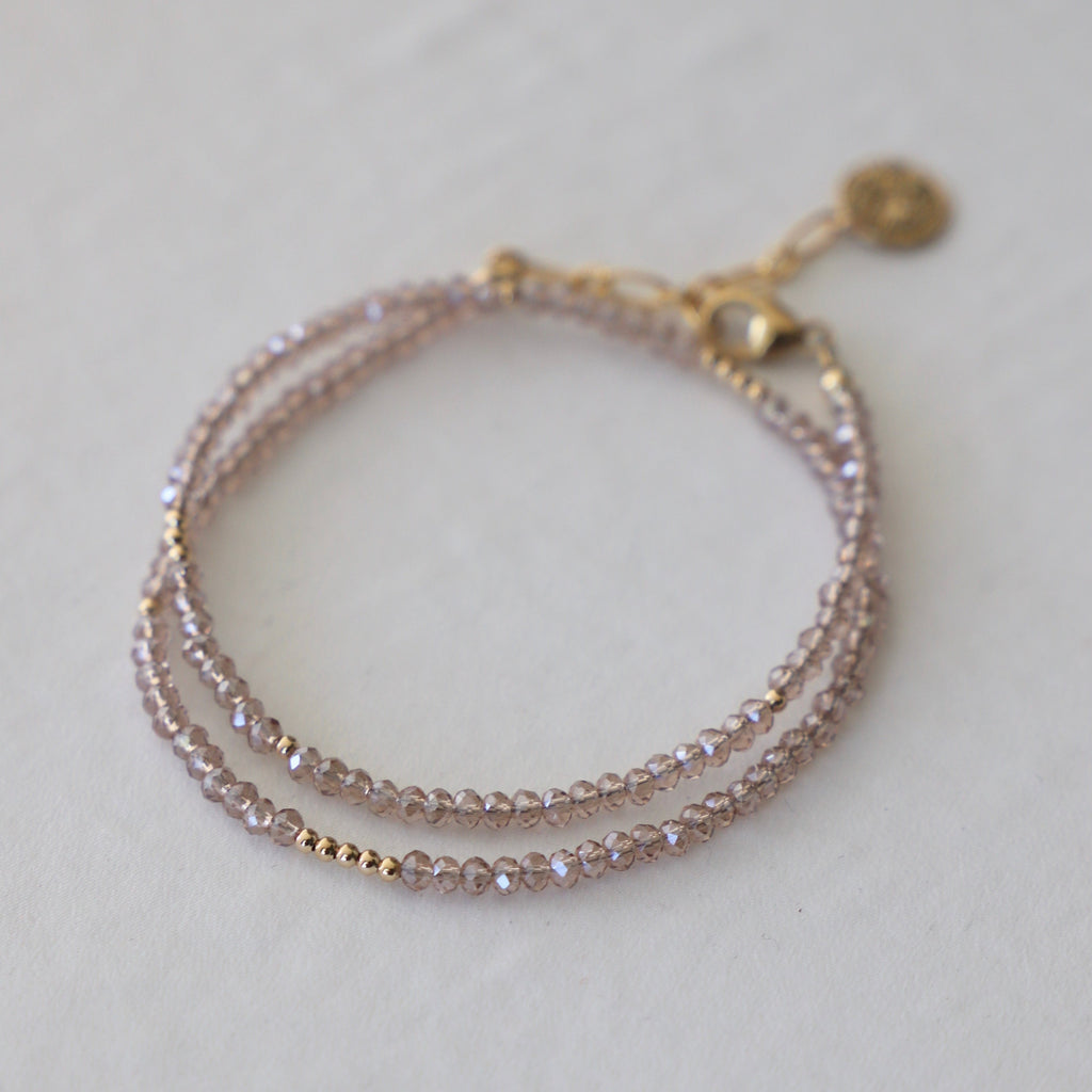 The Petite Champagne Double Wrap Bracelet with Gold Accents is the ultimate fashion accessory.