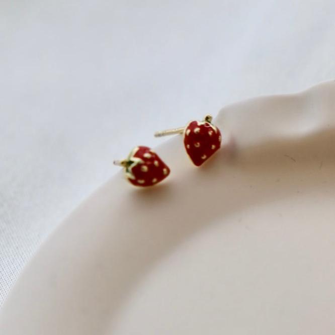 These Mini Strawberry Studs are the perfect addition to any outfit. Made with the sweetest red strawberries, these stud earrings are a charming and playful accessory for any occasion. Elevate your style with these unique and adorable studs.