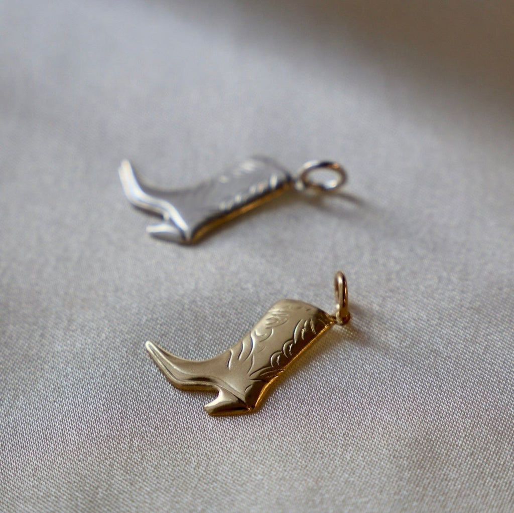 This Cowboy Boot Charm is available in both gold filled and sterling silver options. Crafted with precision and quality, this charm is perfect for any Western-inspired jewelry piece. Add a touch of country flair to your collection with this expertly designed charm.