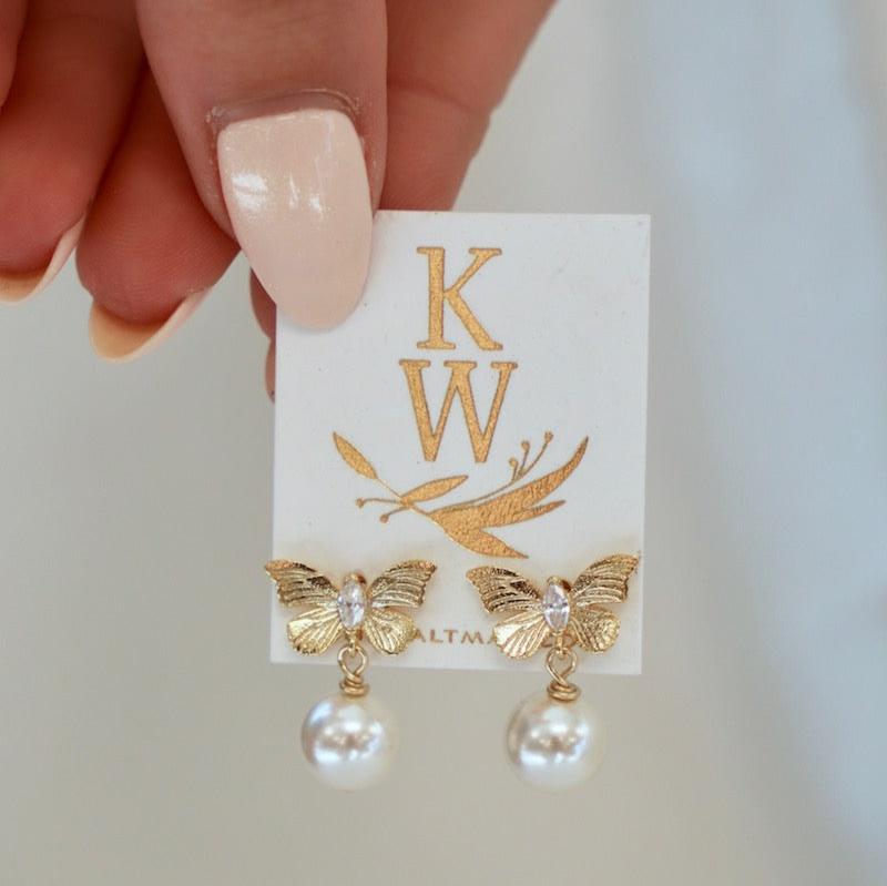 We are in love with everything pearls and butterflies so... we made them into one! This&nbsp;stud features a cubic zirconia and gold butterfly with an attached pearl dropped down from the bodice of the butterfly. This style adds a fun twist to any ear stack!