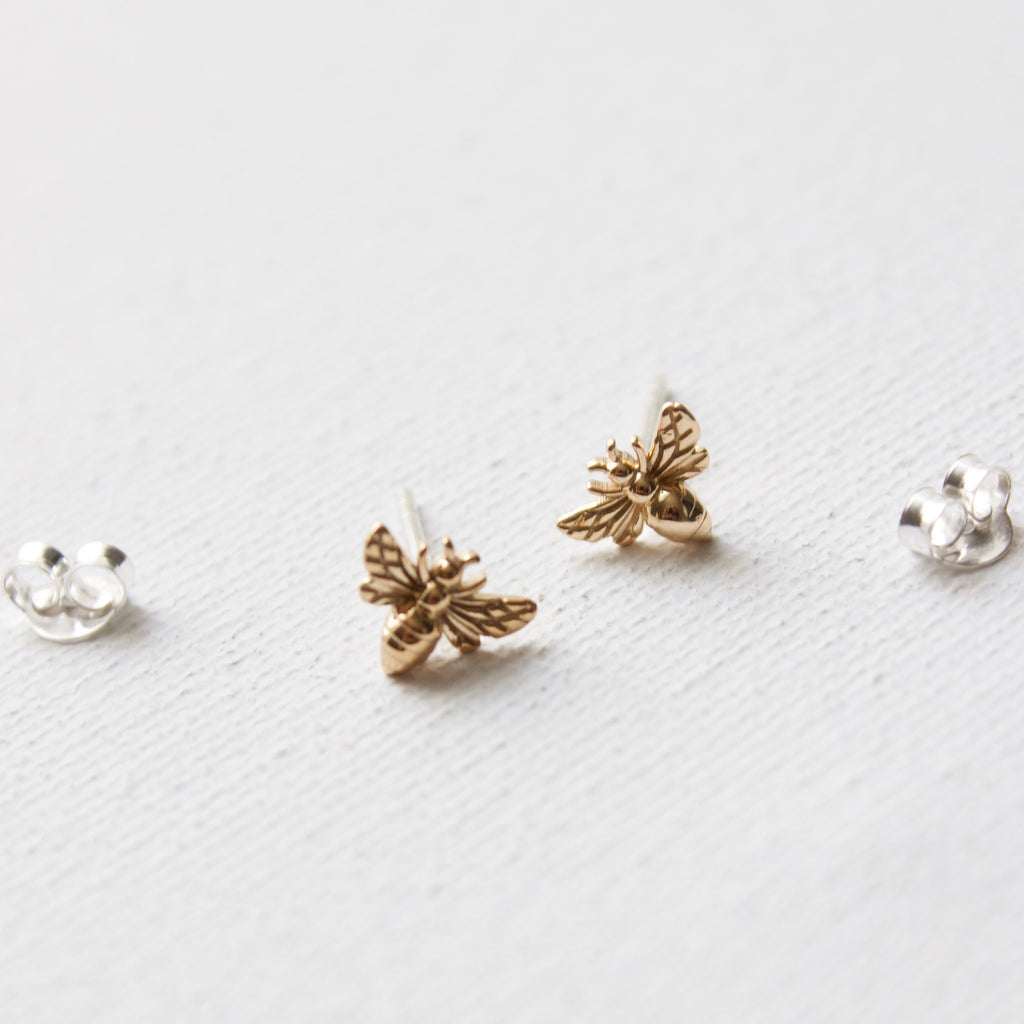 Small and sweet, these BEE STUDS add a subtle hint of happiness to your look. Crafted from sterling silver, they're sure to bring joy to any outfit.