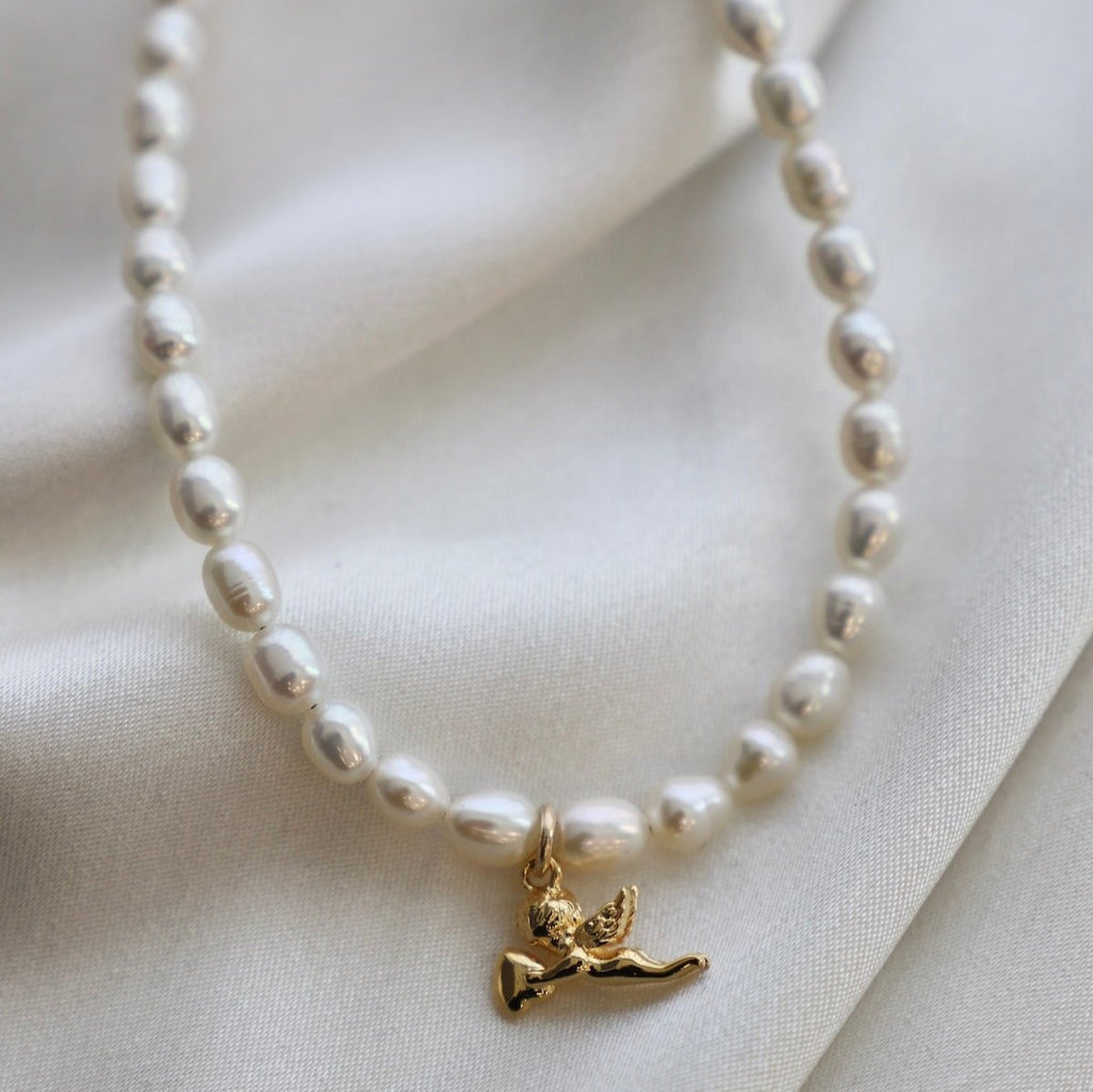 Shoot straight to the heart with the Dear Cupid Necklace. This playful piece features a charming cupids arrow design, perfect for adding a touch of mischief to any outfit. Whether you're looking for love or just want to show off your sense of style, this necklace is sure to make you stand out.