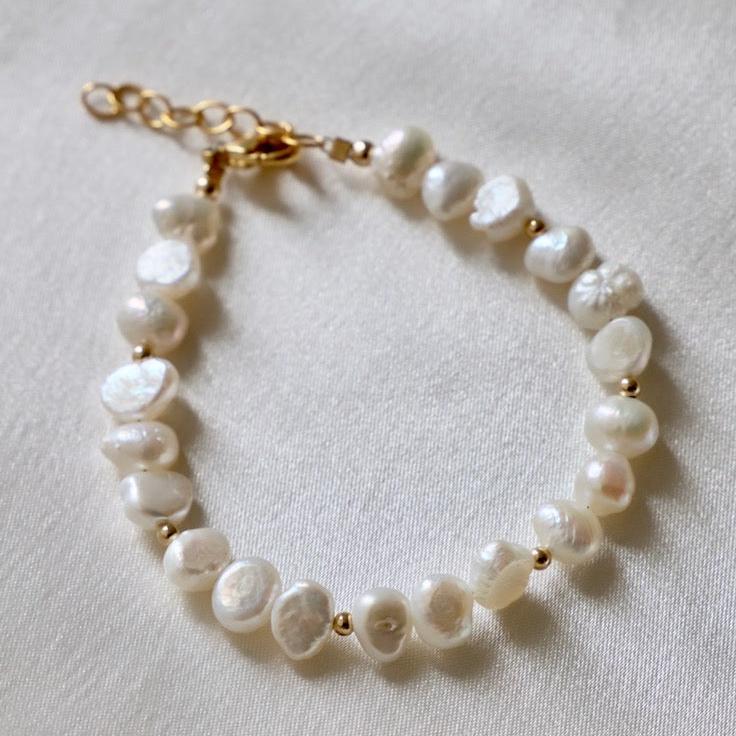 Our Kailani Bracelet is a beautiful beachy bracelet that is perfect to style everyday for this summer season. Made out of our freshwater nugget pearls and gold beaded accents, everyone will be asking you where you got your modern pearl bracelet.