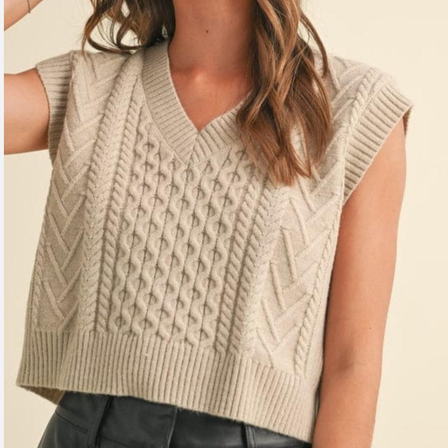 This Tan Sweater Vest is the perfect addition to any wardrobe. This versatile piece can be dressed up or down, keeping you warm and stylish. Don't just blend in, stand out in this quirky and fun vest.