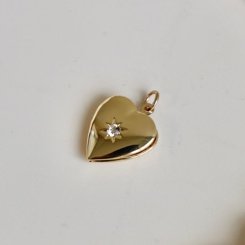 Add a sentimental touch to your charm necklace with our heart locket charm. Keep your loved ones close to your heart with this charming addition. It makes the sweetest gift and the perfect way to show someone you care. We love pairing it with our Gold Filled Beaded Chain or adding it to our Nova Chain Necklace.