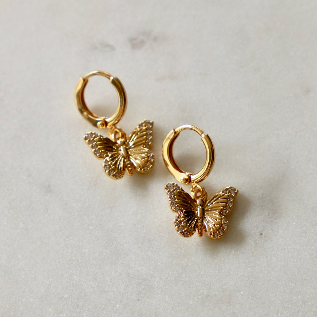 Combining two of our favorite trends, the Butterfly Huggie Hoop Earrings&nbsp;are full of sweet little details. Butterflies are not only beautiful but are full of symbolism representing spiritual rebirth, transformation, change, hope and life.