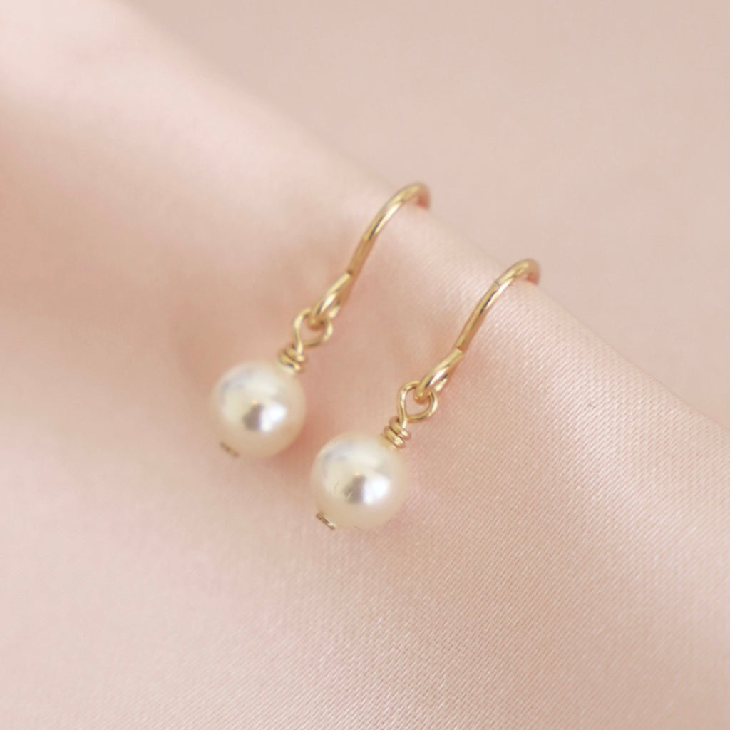 A classic Swarovski pearl on a gold filled ear wire.